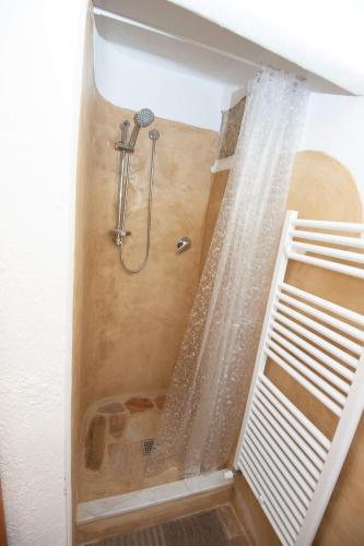 a shower with a shower curtain in a bathroom at Affittacamere degli Dei da Ico in Monzuno