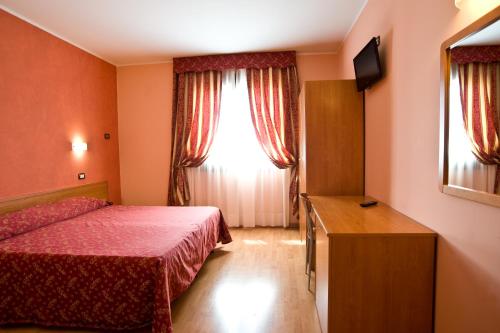 Postel nebo postele na pokoji v ubytování Hotel Colombo