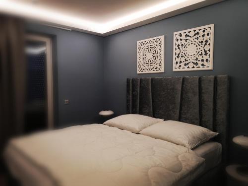 Säng eller sängar i ett rum på Fűzliget Mangó Terrace