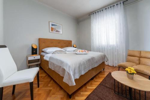 Postel nebo postele na pokoji v ubytování Apartments Prince