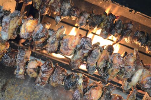 a bunch of food cooking on a grill at Agriturismo dell'Altopiano in Serle