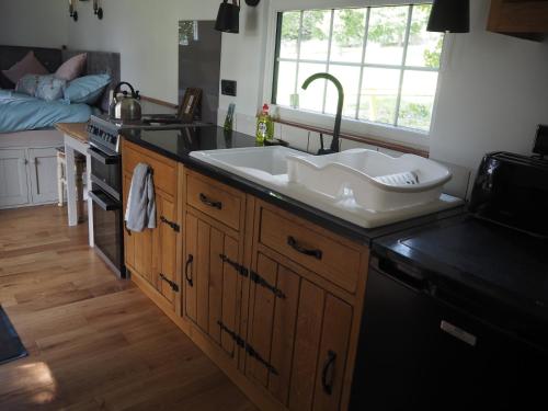 a kitchen with a sink and a counter top at The Owl Hoot in Ipstones