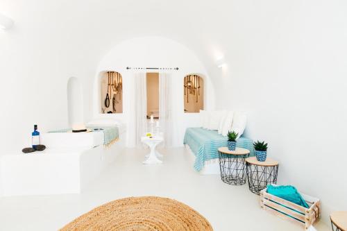 a white room with white walls and white floors at Blessed Blue Boutique Cave Suite in Oia