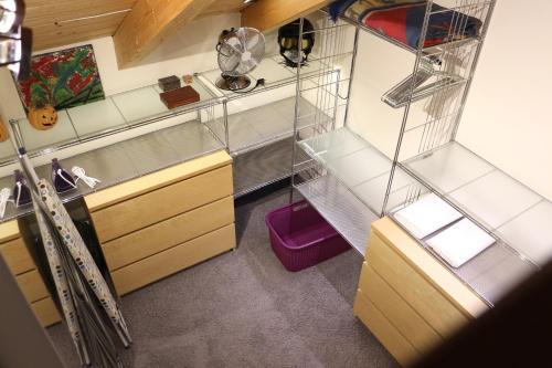 an overhead view of a kitchen with shelves and cabinets at Maisonette Deluxe by fewo-amperland in Olching