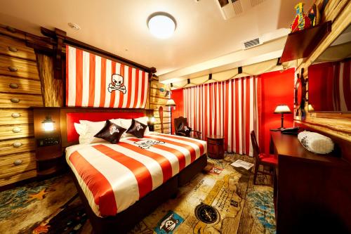 a hotel room with a bed and a desk at LEGOLAND Japan Hotel in Nagoya