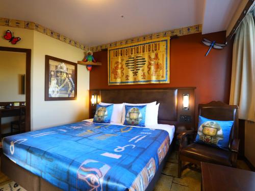 a hotel room with a bed and a chair at LEGOLAND Japan Hotel in Nagoya