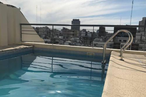 a swimming pool on the roof of a building at Modern Studio between Palermo and Recoleta in Buenos Aires