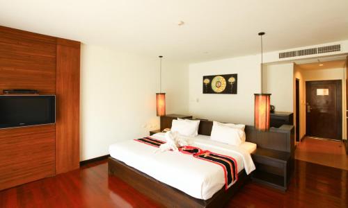 Кровать или кровати в номере Belle Villa Resort, Khao Yai