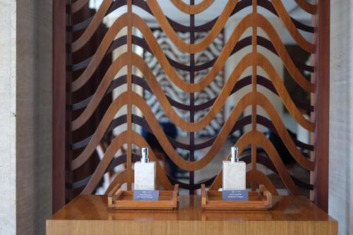 a wall with brown and black stripes on it at The Magani Hotel and Spa in Legian