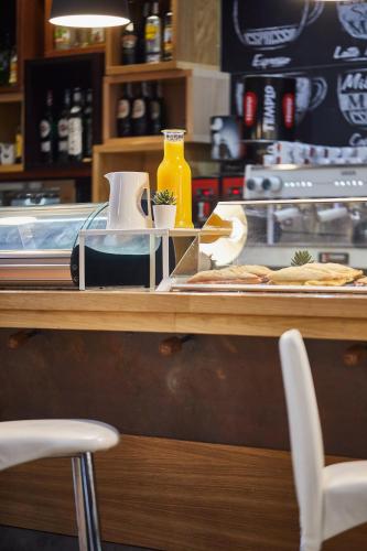 a counter with food on a table in a restaurant at Silken Juan de Austria in Valladolid