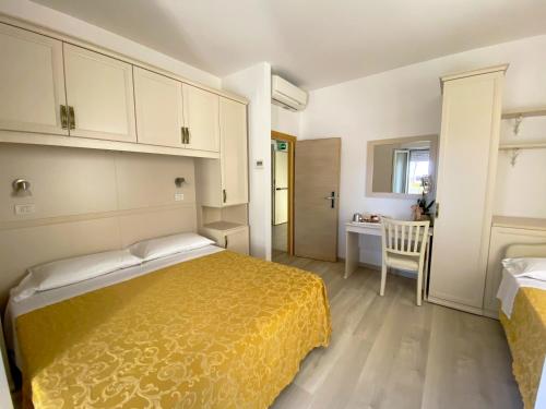 Postel nebo postele na pokoji v ubytování Albergo Villa Aida