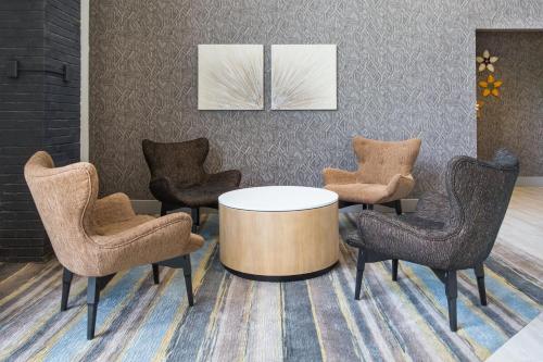 a meeting room with a table and chairs at Holiday Inn Roanoke Airport - Conference CTR by IHG in Roanoke