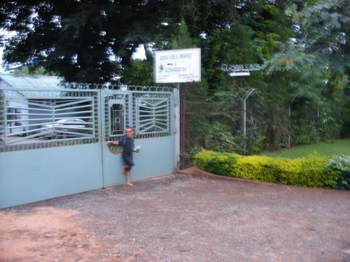 a person standing in the doorway of a garage at Gloria's Bed and Breakfast in Livingstone