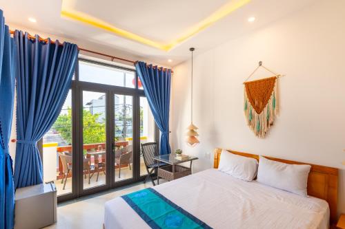 Postel nebo postele na pokoji v ubytování Hoi An Village Villa