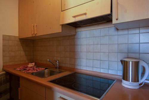 a kitchen with a sink and a counter top at Apartment 7 - Zur Sonne in Laion