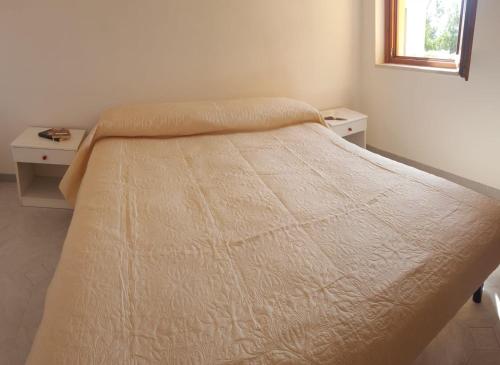 Un pat sau paturi într-o cameră la Casa Gonone