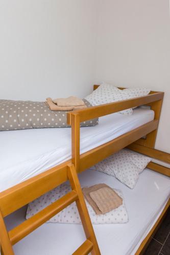 Katil atau katil-katil dalam bilik di Rooms Hercegovka