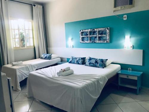 A bed or beds in a room at Pousada Mar E Mata