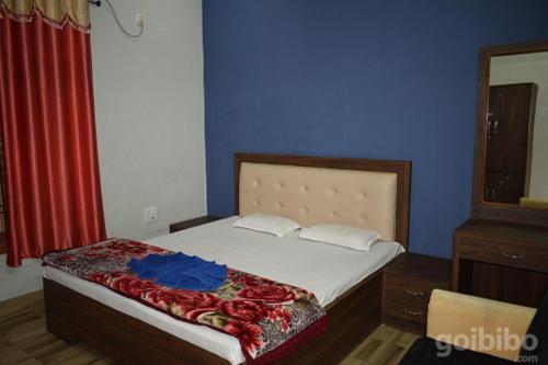 Tempat tidur dalam kamar di Bagori Lodge
