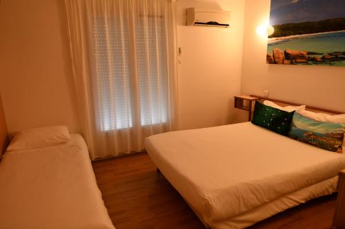 Hôtel Le Claridgeにあるベッド