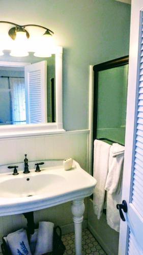 a bathroom with a sink and a mirror at Villa Venezia in Fort Lauderdale