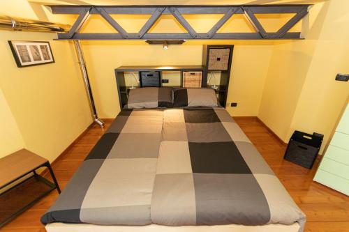 a bedroom with two beds in a room at Antico Opificio Sasso Alloro in Bra