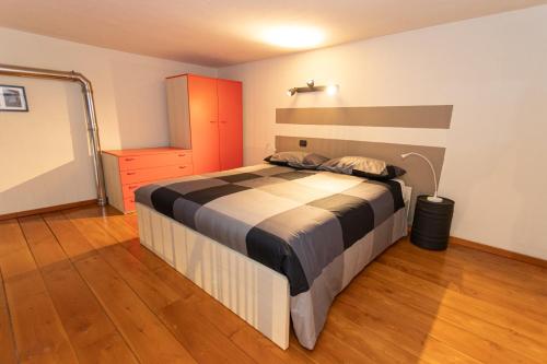 a bedroom with a large bed in a room at Antico Opificio Sasso Alloro in Bra