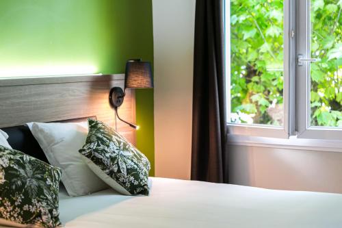 Katil atau katil-katil dalam bilik di Hôtel du Pont