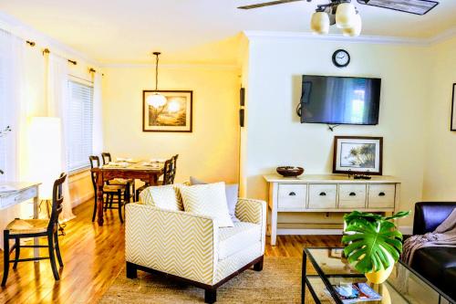 a living room with a couch and a table at Villa Venezia in Fort Lauderdale