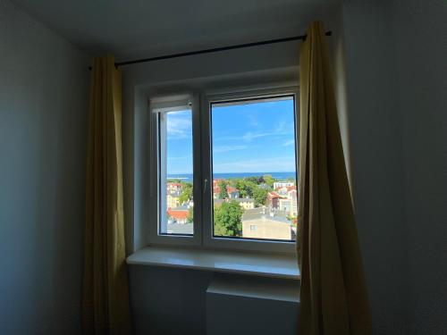 a window with a view of a city at Apartment Sopot in Sopot