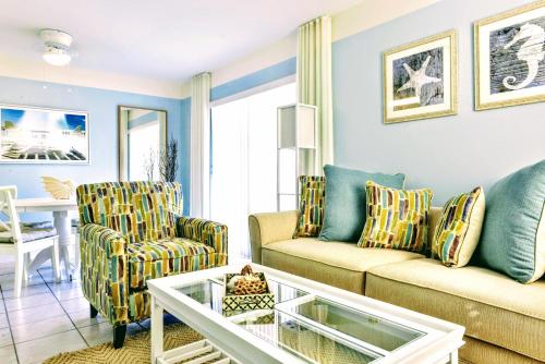 a living room with a couch and two chairs at Villa Venezia in Fort Lauderdale