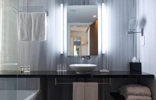 a bathroom with a sink and a mirror at Sunrise Pearl Hotel & Spa in Protaras