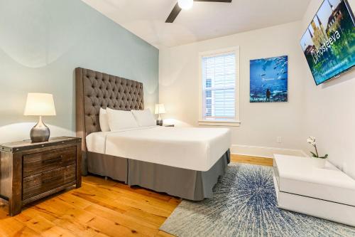 a bedroom with a large white bed and a window at 5BR w Pool - Great for Families - Near Everything in New Orleans