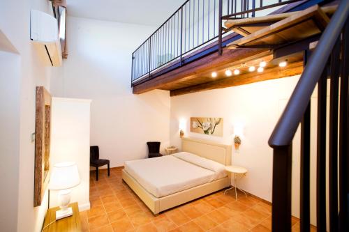 Postel nebo postele na pokoji v ubytování Il Baio Relais & Natural Spa