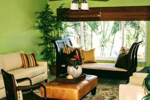 a living room with a couch and a chair at Villa Venezia in Fort Lauderdale