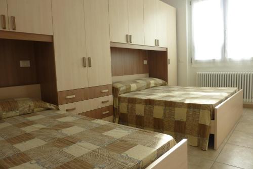 Säng eller sängar i ett rum på Residence Giuliana Dervio