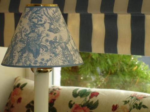 a blue and white lamp sitting on top of a couch at Bayrischer Hof Wohlfühl - Hotel Saarbrücken in Saarbrücken