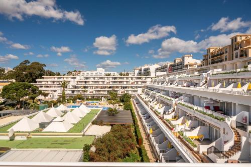an aerial view of a resort with a swimming pool at Muthu Clube Praia da Oura in Albufeira