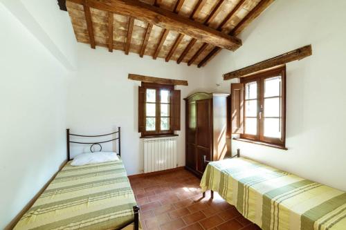 Ένα ή περισσότερα κρεβάτια σε δωμάτιο στο Agriturismo Le Radici