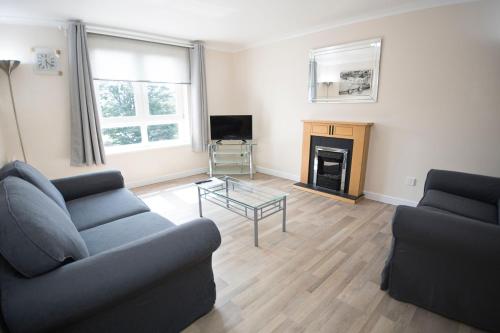 Ein Sitzbereich in der Unterkunft Lochend Serviced Apartments