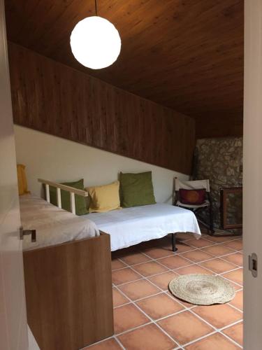 a bedroom with two beds in a room at Casa Montanyés in Conques