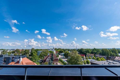 a view of a city from a balcony at Artisa Riia Str 20B Luxury Penthouse apartment in Tartu