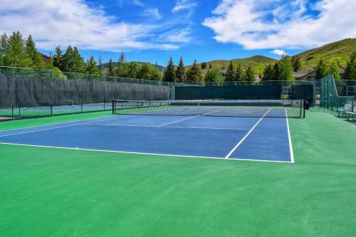 a tennis court with a tennis racket on it at Single Level Ranch Condo in Elkhorn in Sun Valley