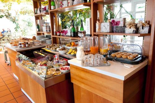 a buffet line with many different types of food at Hotel Goldinger in Landstuhl