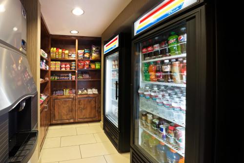 a refrigerator filled with lots of soda and drinks at Holiday Inn Express Show Low by IHG in Show Low