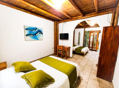 A bed or beds in a room at Tuzco Lodge