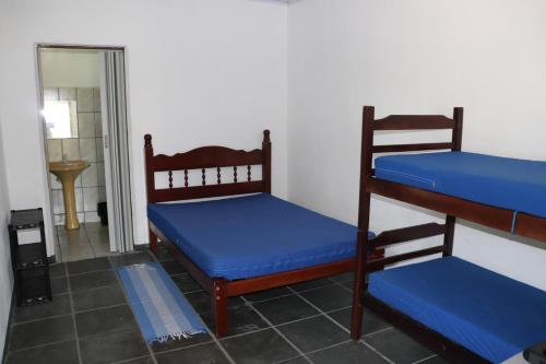 Posteľ alebo postele v izbe v ubytovaní Nosso Chalé na Ilha