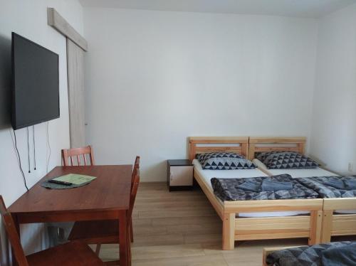 Postel nebo postele na pokoji v ubytování Apartmány Opolany