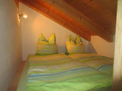 a bedroom with two beds in a attic at Biohof Babel in Sachsenkam