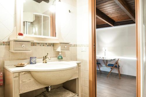 a bathroom with a sink and a tub at A Casa Di Eta in Gaeta